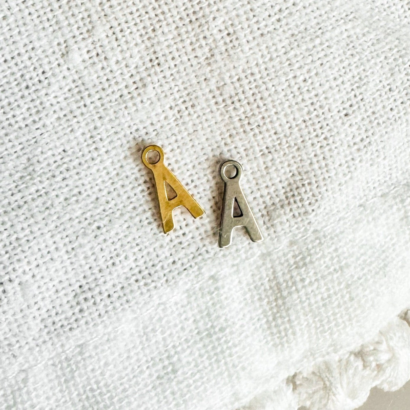 TINY INITIAL CHARM