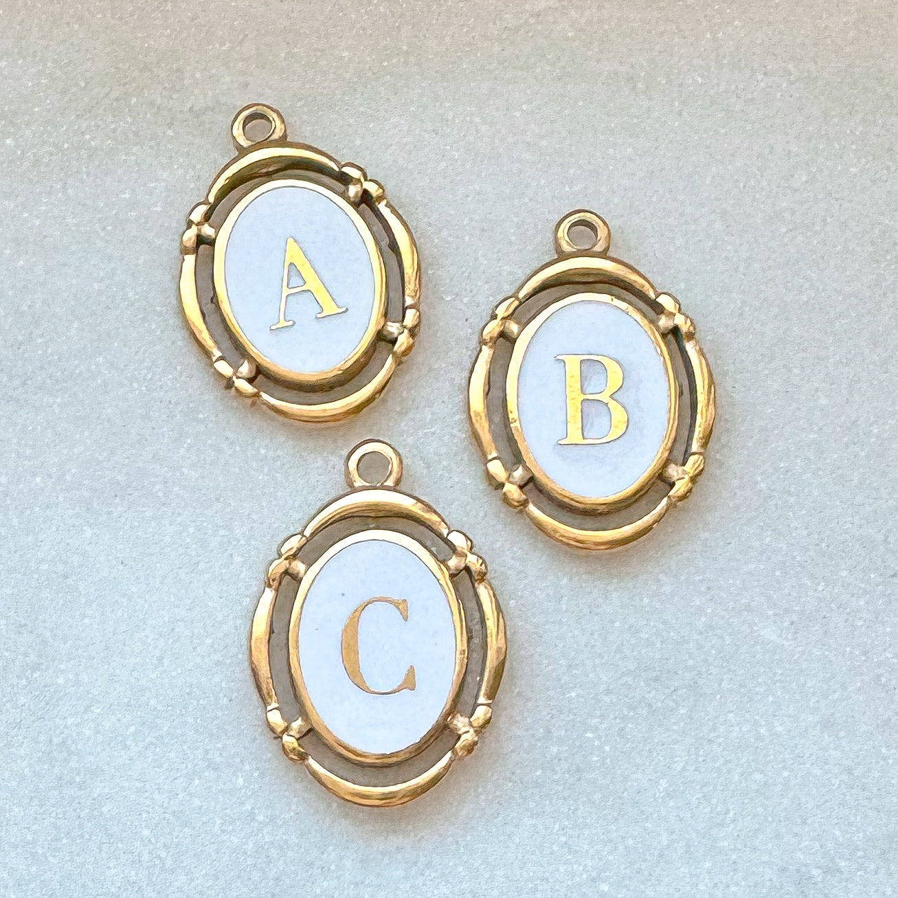 WHITE INITIAL CHARM