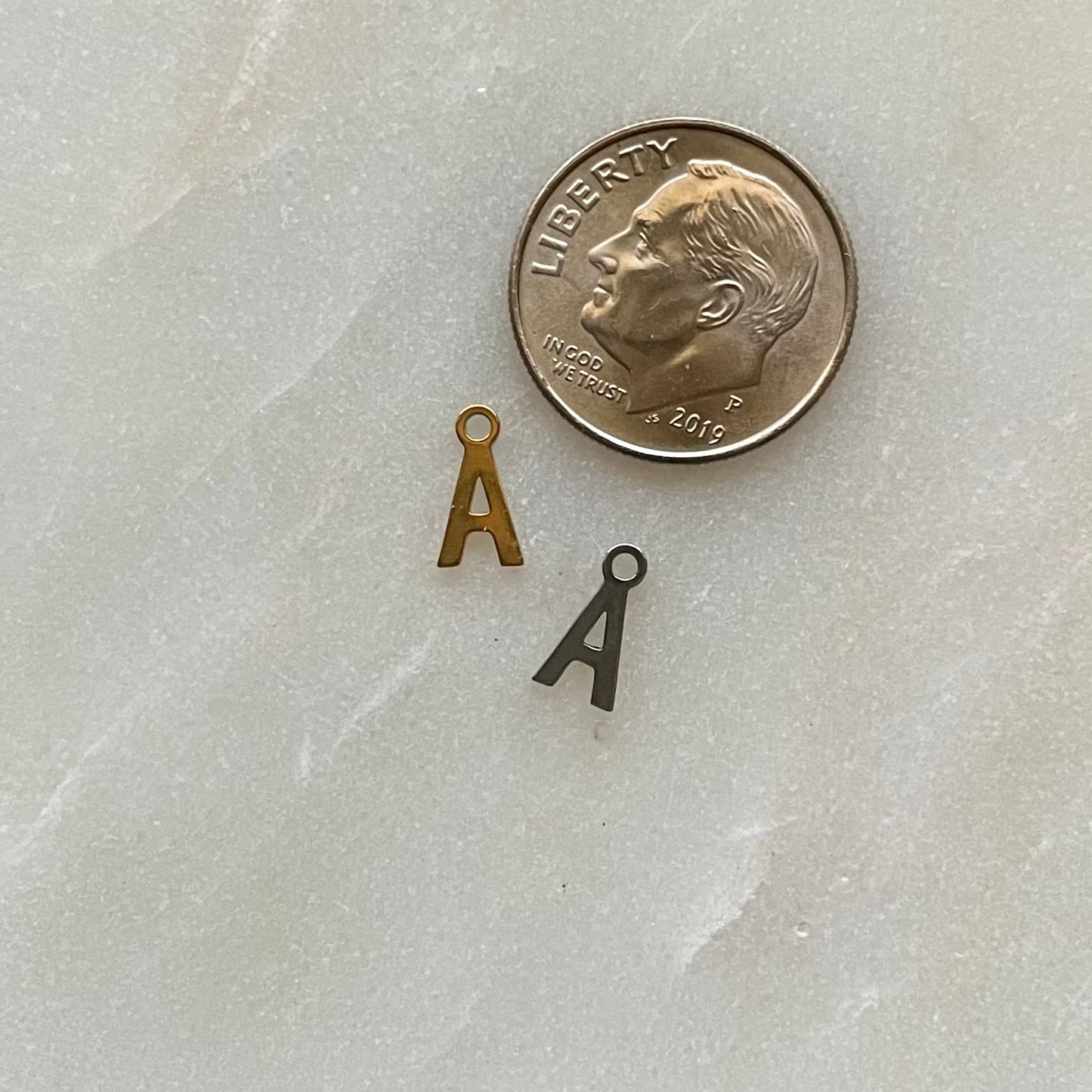 TINY INITIAL CHARM